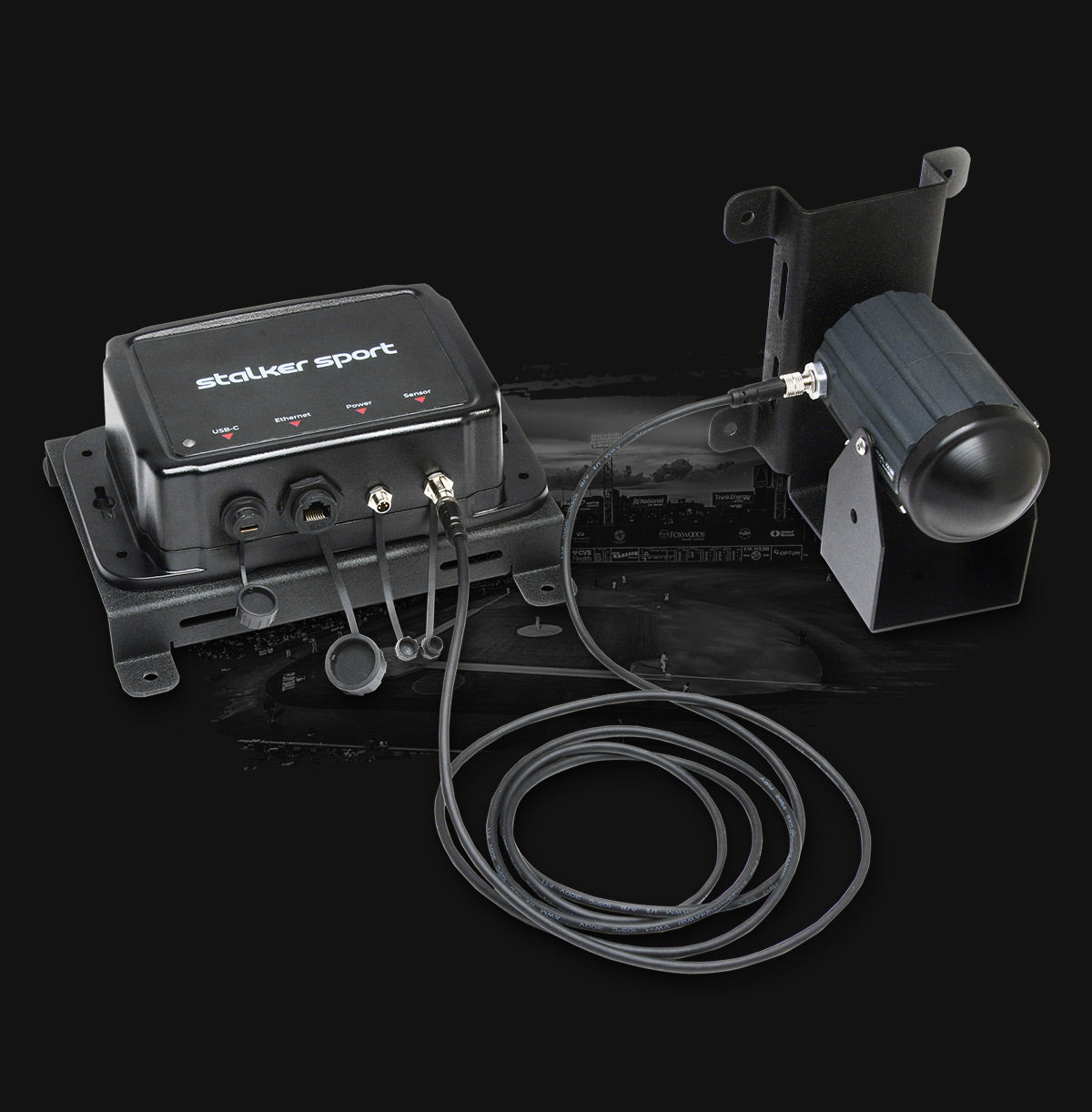 Stalker Sport Sensor 3s & Stadium Hub with connected cable on a dark background.