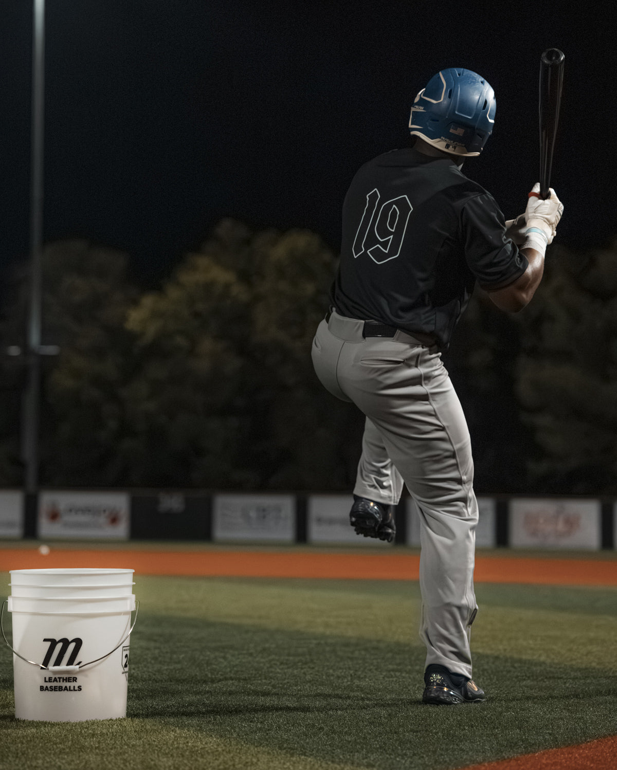 Stalker Sport batter practicing in a baseball field at night.
