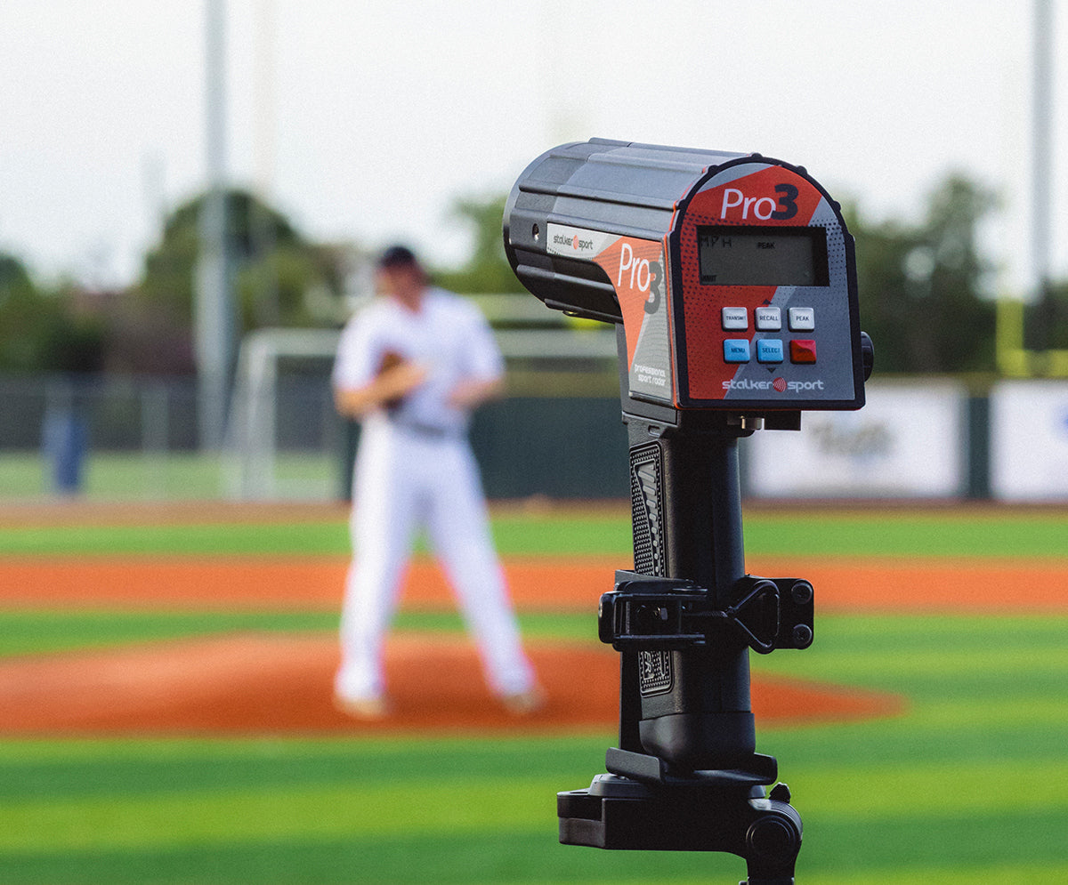 The Pro 3 sports radar from Stalker Sport in a tripod mount measuring velocities at a baseball game.
