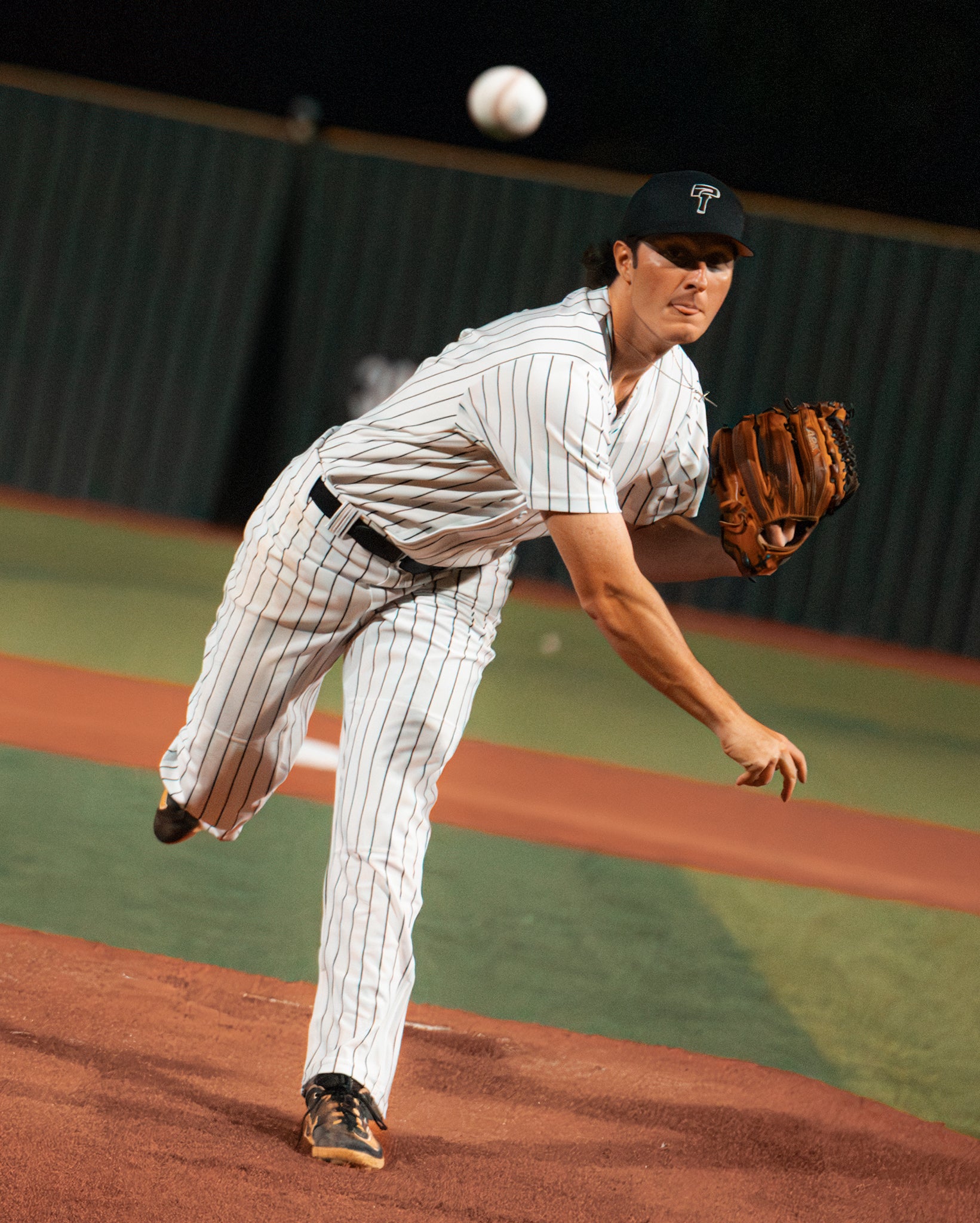A pitcher from Team Stalker Sport throwing a baseball.