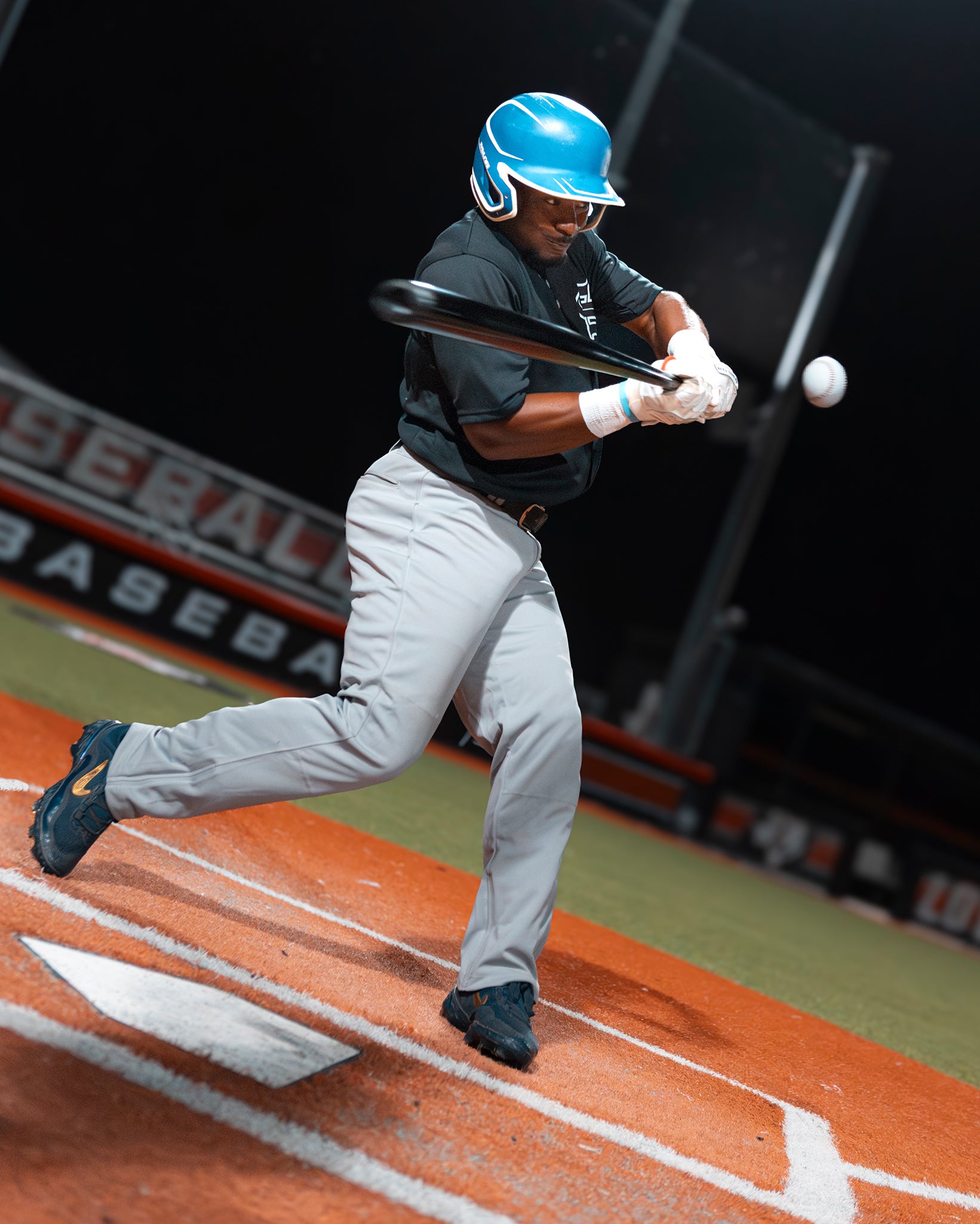 A player from Team Stalker Sport batting a baseball.