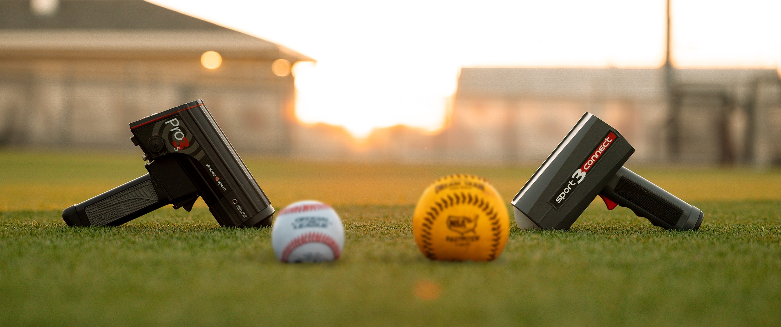 The Stalker Sport Pro 3s and Sport 3 Connect on a field with a baseball and a softball. 