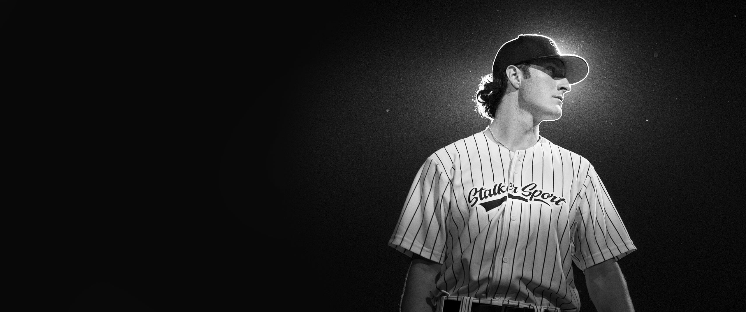 A male baseball player wearing a Stalker Sport jersey.