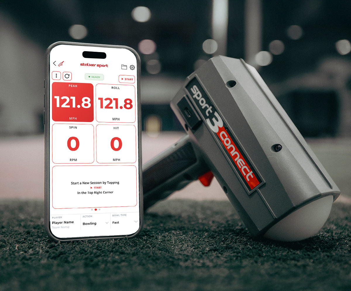 A Sport 3 Connect radar gun on an indoor field next to a mobile phone displaying the Stalker Sport App. 
