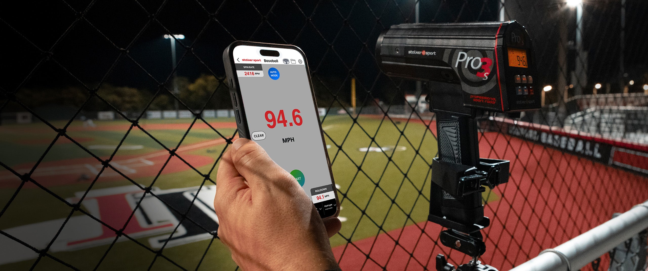 A hand holding a phone using the Stalker Sport Radar App displaying a speed of 94.6 MPH. It is next to a Pro 3s sport radar gun that is mounted to a tripod. 