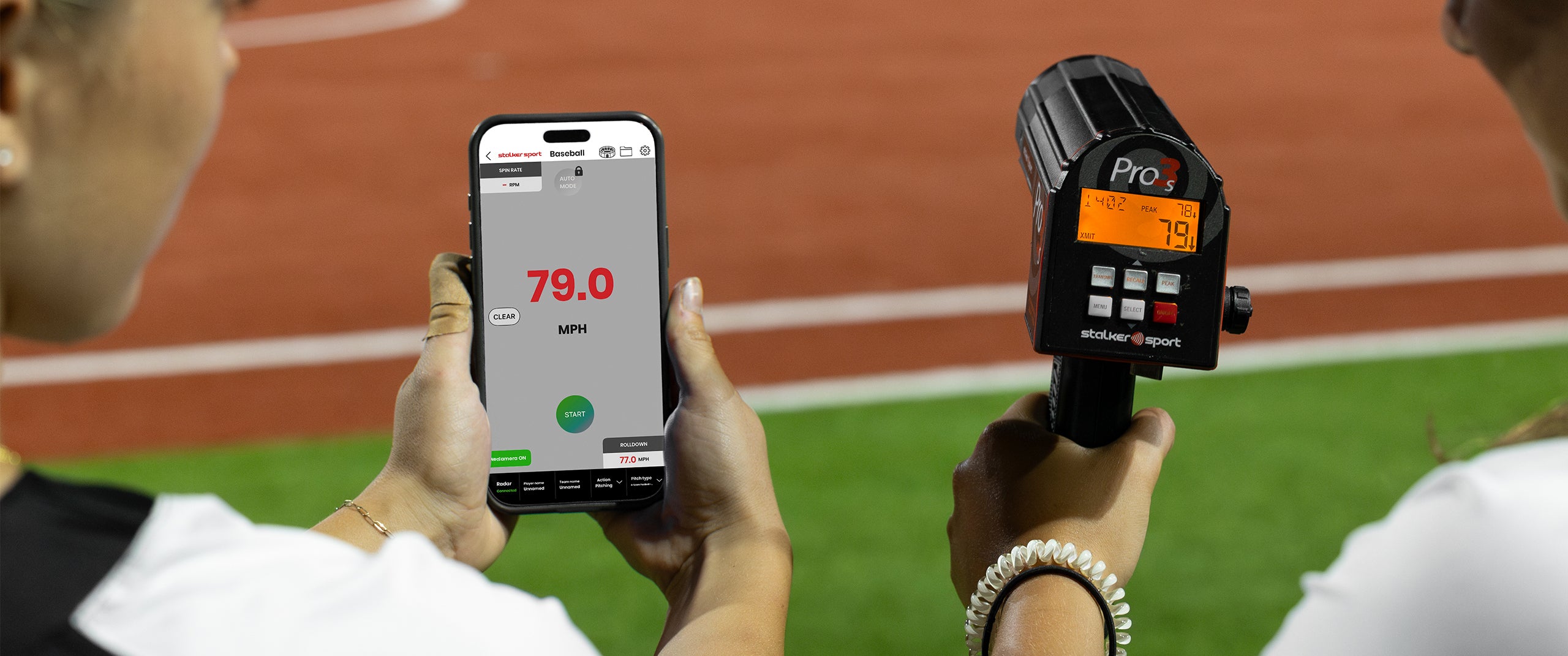 Two softball players using a Pro 3s with the Stalker Sport Radar app showing a velocity of 79.0 MPH.